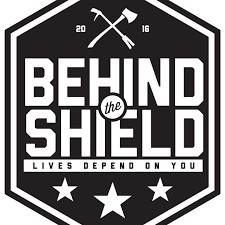 logo behind the shield